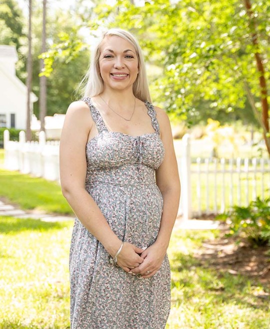 Ashley standing outside